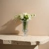 A transparent carved glass vase with a white rose bouquet for home decoration Application Scenario